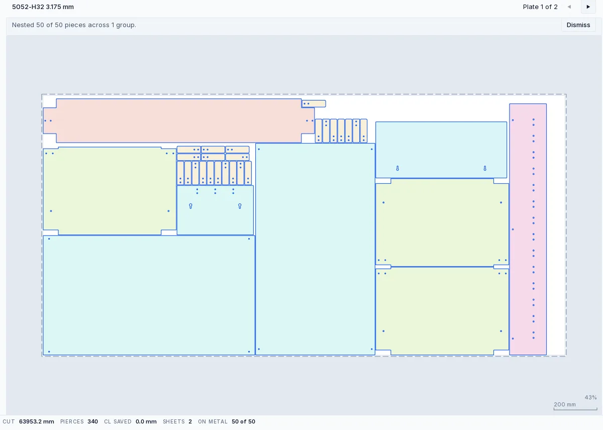A solved sheet nest on a 48 by 96 inch plate of 5052-H32 aluminium: a console top, shelves, legs, hook bodies and an angle strip packed true-shape, with smaller parts sitting inside the window cut out of a larger one. The stats strip beneath reads 63,953.2 mm of cut, 340 pierces, nothing saved to common lines, two sheets, and fifty of fifty pieces on metal.
